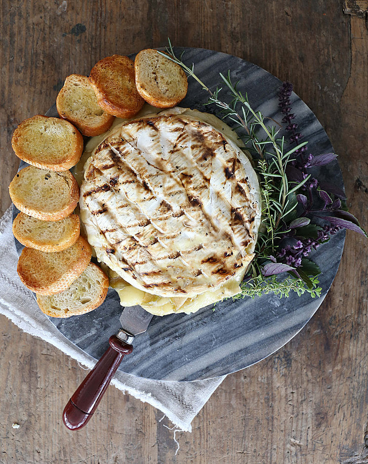 Grilled Brie Stuffed with Piloncillo Caramelized Apples